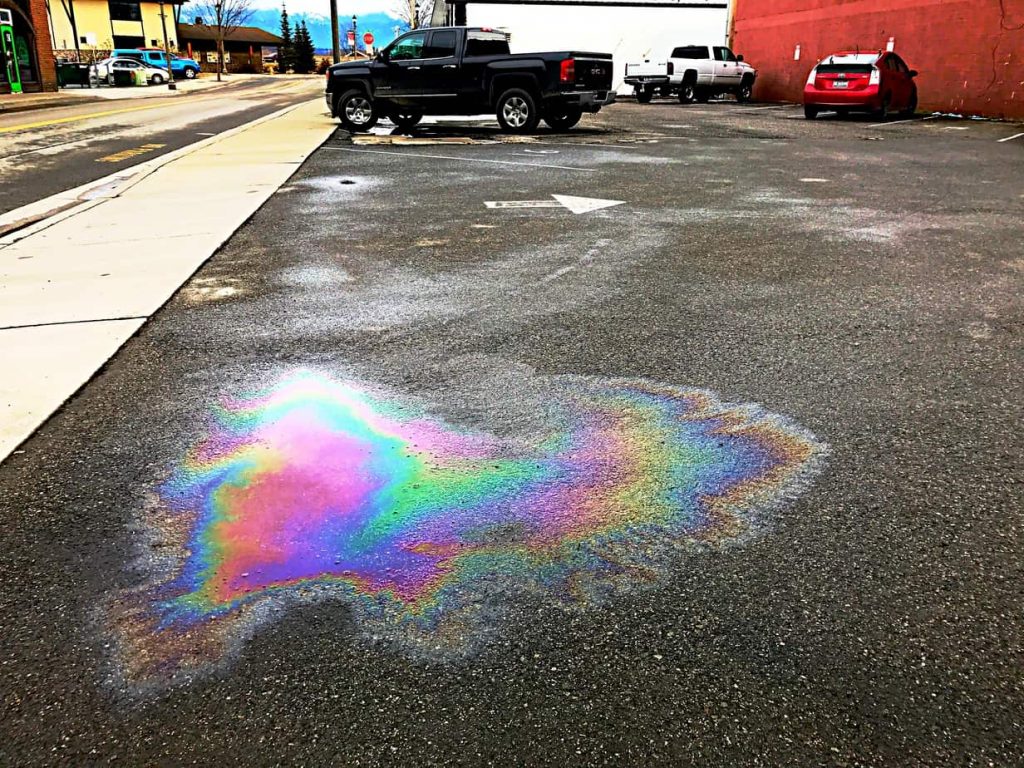 Minor Spillage in Parking Lot from Vehicles